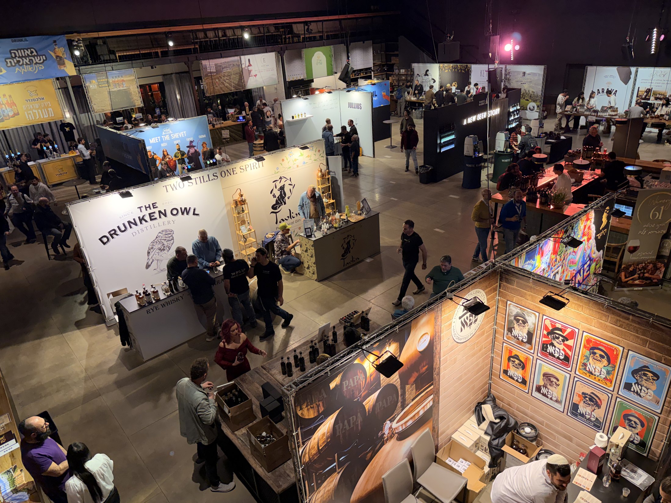 Overhead view of stands and visitors throughout the hall.