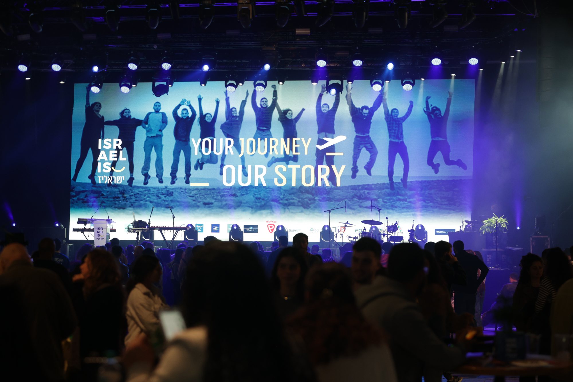 Wide view of the stage and audience during the programme.