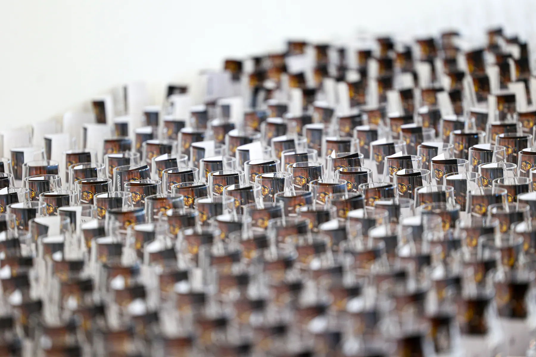 Close-up of rows of small spirits bottles.